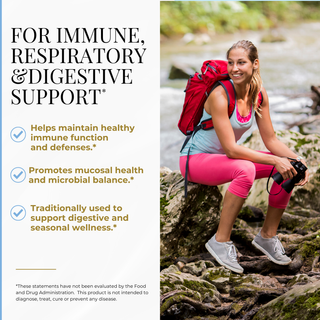 A promotional graphic with text on the left reading 'FOR IMMUNE, RESPIRATORY & DIGESTIVE SUPPORT' and three benefit bullet points, alongside a woman hiking on rocks by a stream wearing a red backpack, pink leggings, and white sneakers.