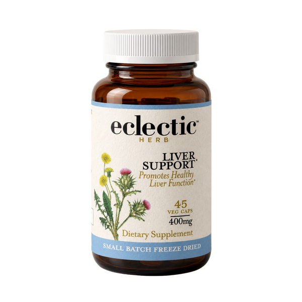 Bottle of concentrated herbal liver support supplement with milk thistle, dandelion, and turmeric ingredients