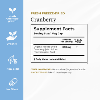 A supplement facts panel for Fresh Freeze-Dried Cranberry capsules, shown on a white background with a light blue vertical sidebar on the left. The sidebar includes icons and text for North American-grown, Organic, Non-GMO, and No Fillers.